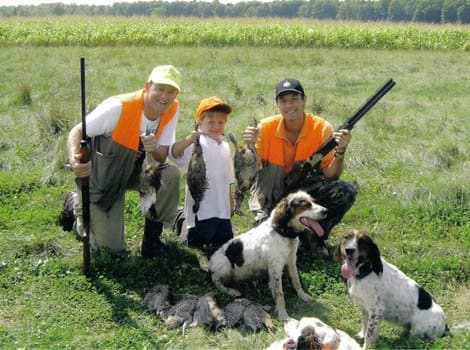 Family hunt — adults and youth with dogs and birds