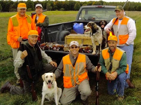 Hunters and dogs after a successful hunt