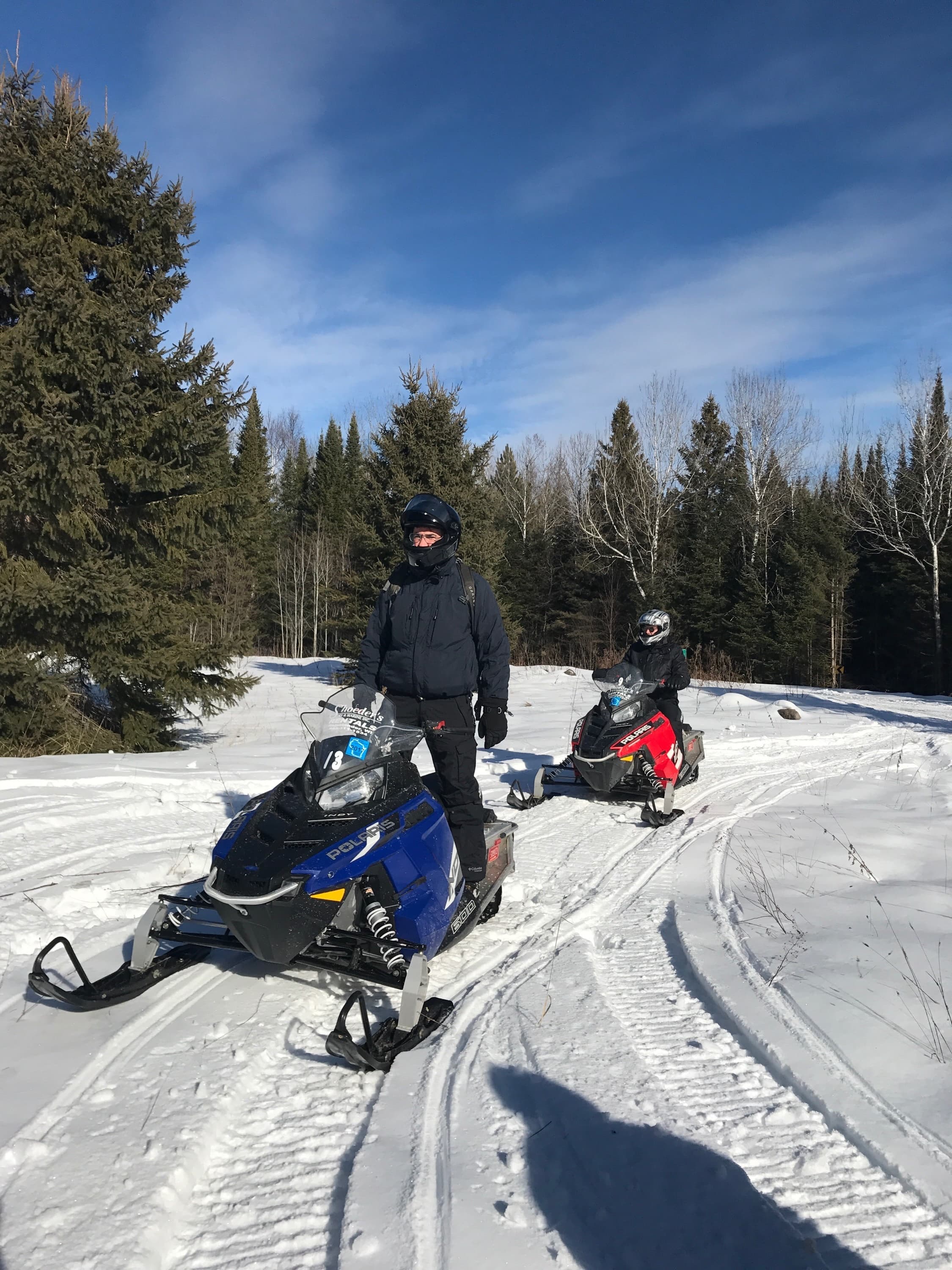 Snowmobiling on a sunny Northwoods day