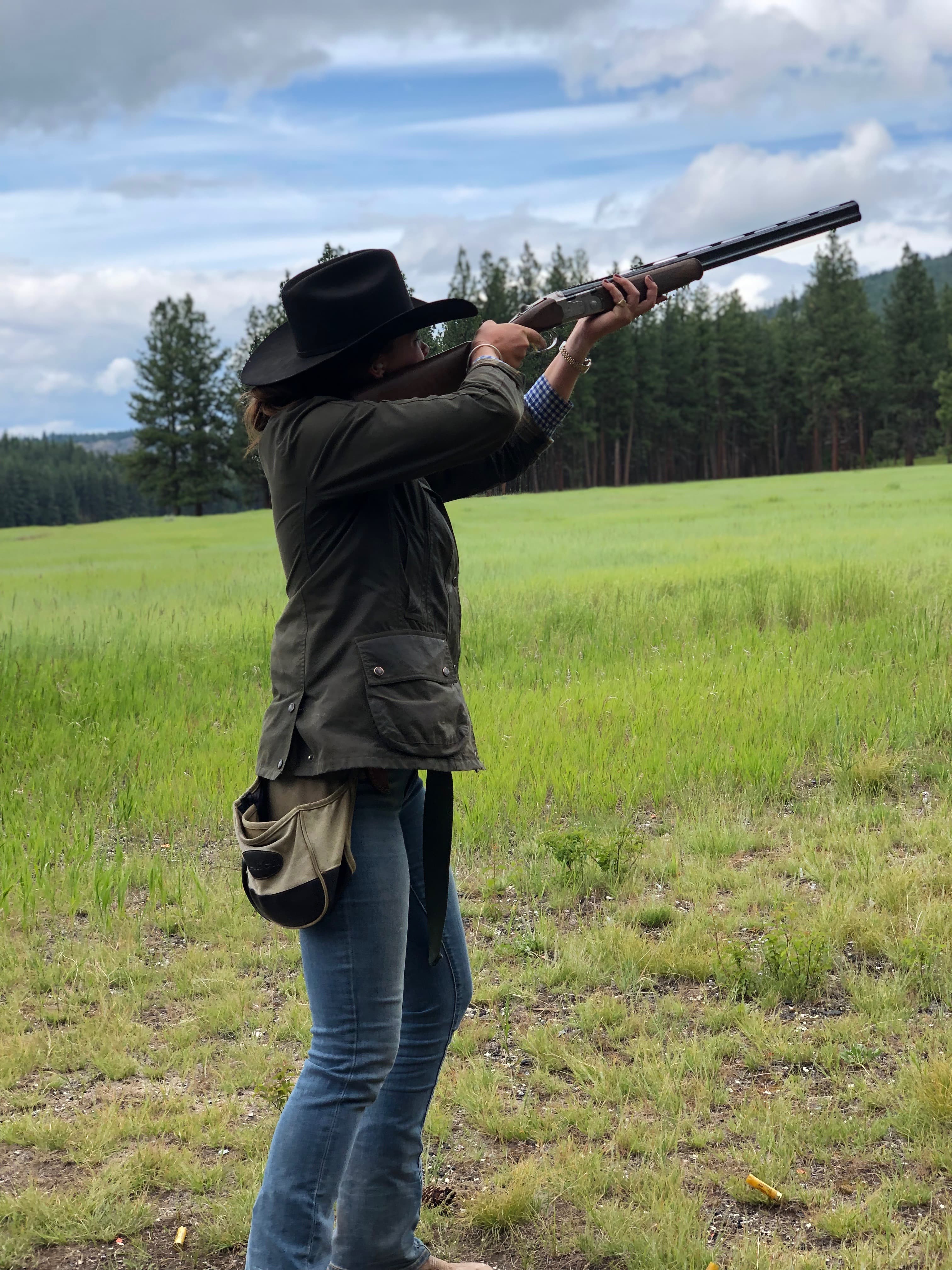 Woman shooting sporting clays